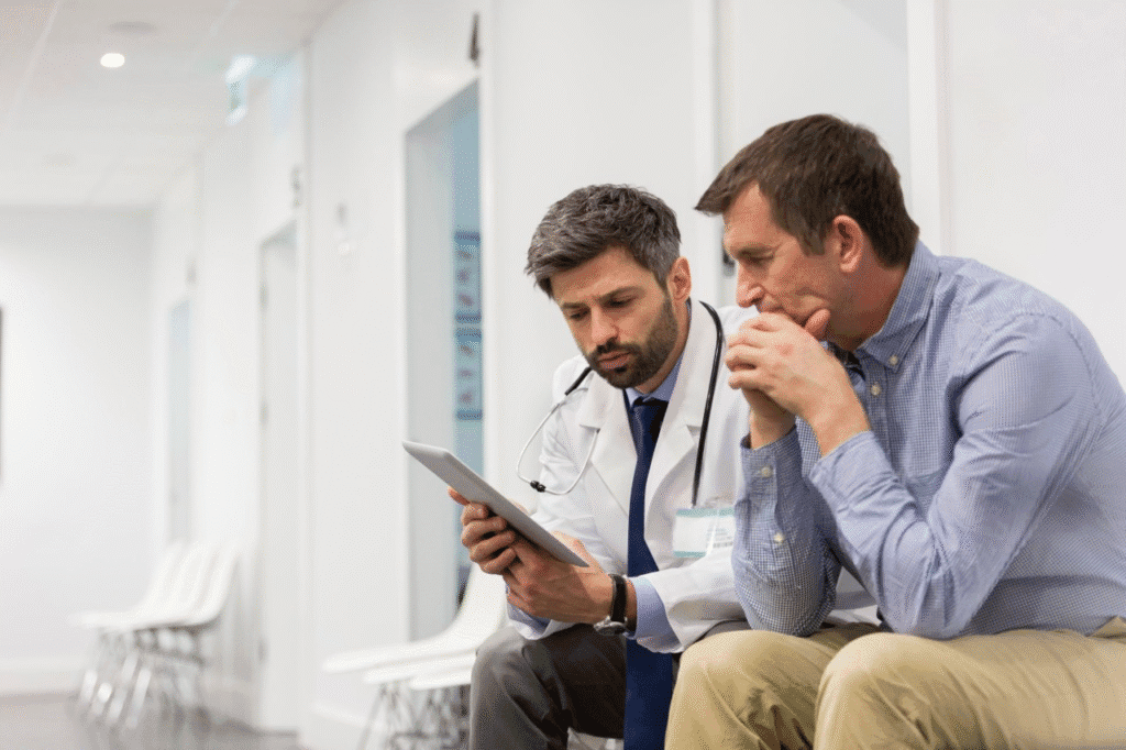 adult doctor explaining serious patient